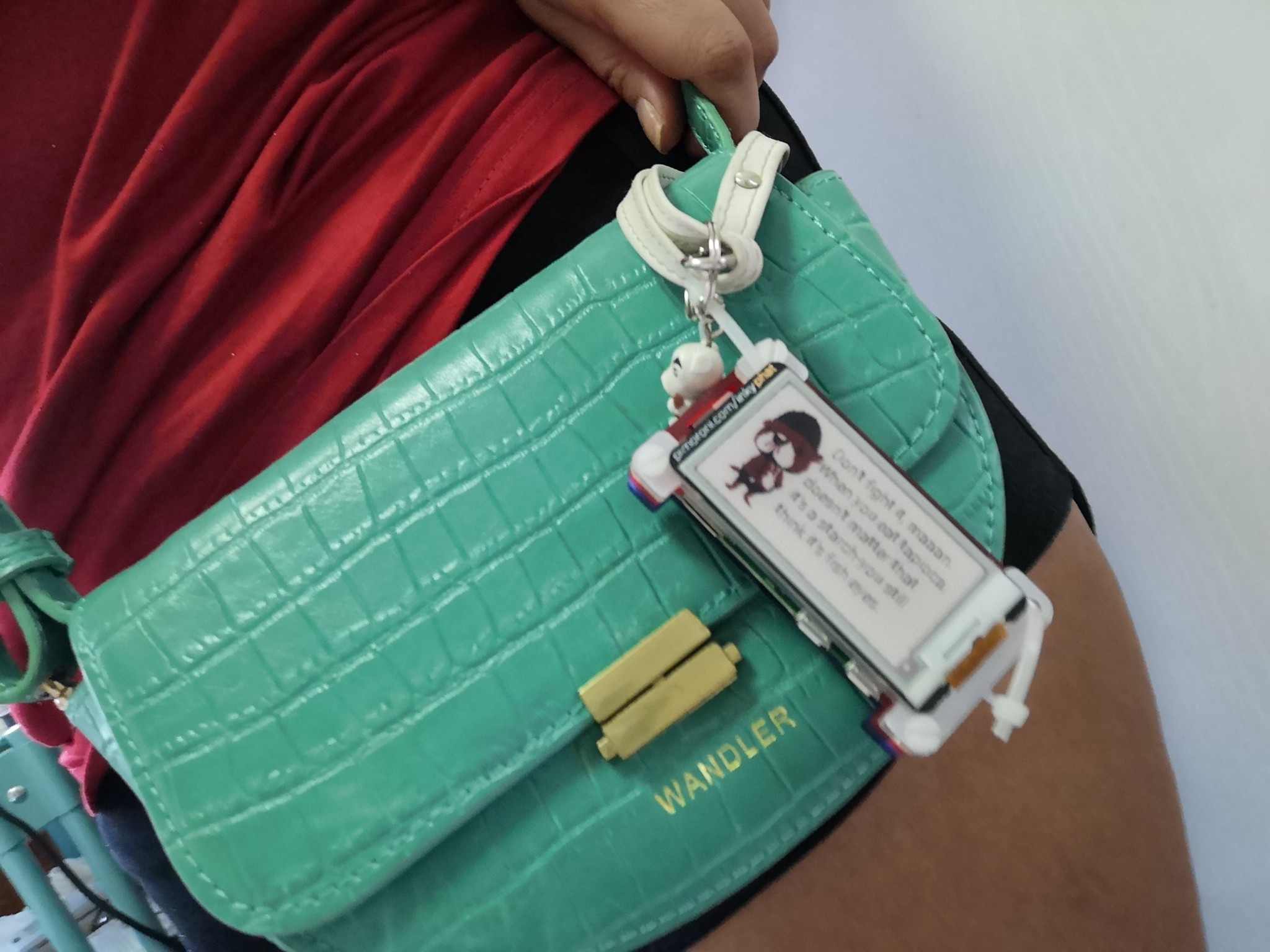 image of inkyphat with a pascal quote hung from a bag like a bag charm